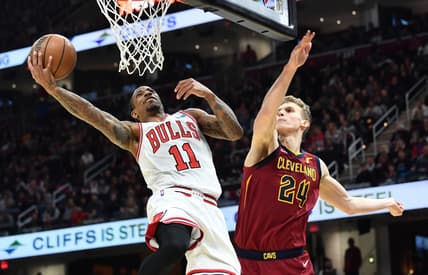 Mar 26, 2022; Cleveland, Ohio, USA; Chicago Bulls forward DeMar DeRozan (11) drives to the basket against Cleveland Cavaliers forward Lauri Markkanen (24) during the second half at Rocket Mortgage FieldHouse. Mandatory Credit: Ken Blaze-USA TODAY Sports
