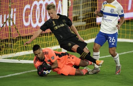 Sep 2, 2020; Los Angeles, CA, Los Angeles, CA, USA; LAFC forward Danny Musovski (16) collides with San Jose Earthquakes goalkeeper Daniel Vega (17) in the second half at Banc of California Stadium . LAFC defeated the Earthquakes 5-1. Mandatory Credit: Kirby Lee-USA TODAY Sports