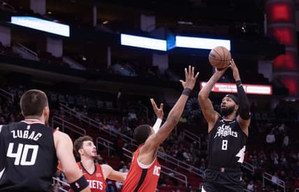 Nov 14, 2022; Houston, Texas, USA;  LA Clippers forward Marcus Morris Sr. (8) shoots against Houston Rockets forward Jabari Smith Jr. (1) in the first quarter at Toyota Center. Mandatory Credit: Thomas Shea-USA TODAY Sports