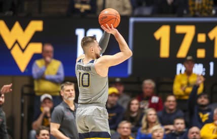 Feb 4, 2023; Morgantown, West Virginia, USA; West Virginia Mountaineers guard Erik Stevenson (10) shoots a three point basket against the Oklahoma Sooners during the first half at WVU Coliseum. Mandatory Credit: Ben Queen-USA TODAY Sports