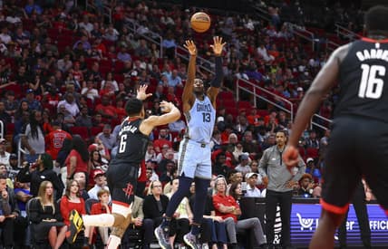 Mar 1, 2023; Houston, Texas, USA; Memphis Grizzlies forward Jaren Jackson Jr. (13) shoots the ball as Houston Rockets forward KJ Martin (6) defends during the second quarter at Toyota Center. Mandatory Credit: Troy Taormina-USA TODAY Sports