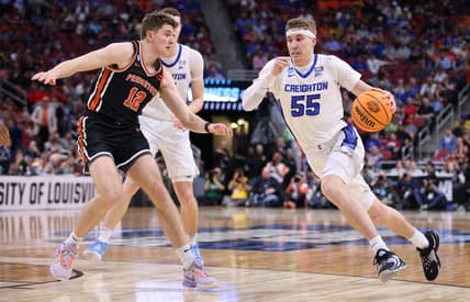 Mar 24, 2023; Louisville, KY, USA; Creighton Bluejays guard Baylor Scheierman (55) drives against Princeton Tigers forward Caden Pierce (12) during the second half of the NCAA tournament round of sixteen at KFC YUM! Center. Mandatory Credit: Jordan Prather-USA TODAY Sports