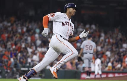 Apr 5, 2023; Houston, Texas, USA; Detroit Tigers relief pitcher Garrett Hill (50) reacts and Houston Astros shortstop Jeremy Pena (3) runs to first base on a double during the seventh inning at Minute Maid Park. Mandatory Credit: Troy Taormina-USA TODAY Sports