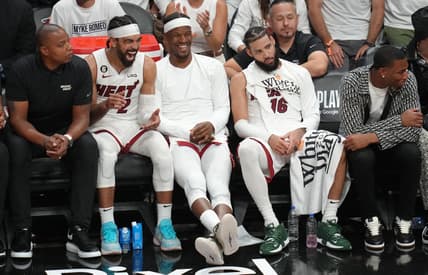 May 21, 2023; Miami, Florida, USA; Miami Heat guard Gabe Vincent (2), forward Jimmy Butler (22) and forward Caleb Martin (16) on the bench during the second half against the Boston Celtics in game three of the Eastern Conference Finals for the 2023 NBA playoffs at Kaseya Center. Mandatory Credit: Jim Rassol-USA TODAY Sports
