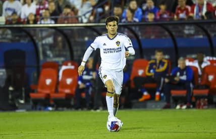 Mar 4, 2023; Frisco, Texas, USA;  Los Angeles Galaxy midfielder Riqui Puig (6) dribbles the ball during the second half against FC Dallas at Toyota Stadium. Mandatory Credit: Kevin Jairaj-USA TODAY Sports