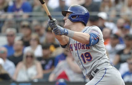 Jun 10, 2023; Pittsburgh, Pennsylvania, USA;  New York Mets first baseman Mark Canha (19) hits a two run double against the Pittsburgh Pirates during the seventh inning at PNC Park. Mandatory Credit: Charles LeClaire-USA TODAY Sports