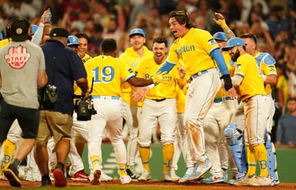 Aug 7, 2023; Boston, Massachusetts, USA; Boston Red Sox shortstop Pablo Reyes (19) is greeted at home plate after hitting a home run with the bases loaded to end the game against the Kansas City Royals in the ninth inning at Fenway Park. Mandatory Credit: David Butler II-USA TODAY Sports