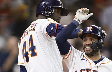 Aug 24, 2022; Houston, Texas, USA; Houston Astros designated hitter Yordan Alvarez (44) and second baseman Jose Altuve (27) celebrates his home run against the Minnesota Twins in the first inning at Minute Maid Park. Mandatory Credit: Thomas Shea-USA TODAY Sports
