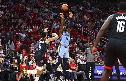 Mar 1, 2023; Houston, Texas, USA; Memphis Grizzlies forward Jaren Jackson Jr. (13) shoots the ball as Houston Rockets forward KJ Martin (6) defends during the second quarter at Toyota Center. Mandatory Credit: Troy Taormina-USA TODAY Sports