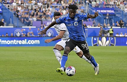 Jul 22, 2023; Montreal, Quebec, CAN; CF Montreal forward Kwadwo Opoku (90) dribbles against UNAM defender Nathan Silva (6) during the first half of a Leagues Cup game at Stade Saputo. Mandatory Credit: Eric Bolte-USA TODAY Sports