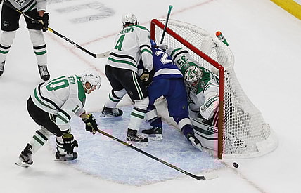 Sep 26, 2020; Edmonton, Alberta, CAN; Tampa Bay Lightning center Brayden Point (21) is shoved into the net of Dallas Stars goaltender Anton Khudobin (35) during overtime in game five of the 2020 Stanley Cup Final at Rogers Place. Mandatory Credit: Perry Nelson-USA TODAY Sports