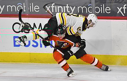 Feb 3, 2021; Philadelphia, Pennsylvania, USA; Philadelphia Flyers right wing Nicolas Aube-Kubel (62) checks Boston Bruins defenseman Jakub Zboril (67) during the first period at Wells Fargo Center. Mandatory Credit: Eric Hartline-USA TODAY Sports