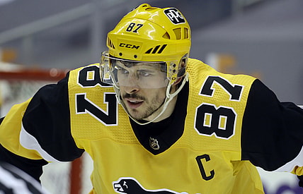 Mar 16, 2021; Pittsburgh, Pennsylvania, USA;  Pittsburgh Penguins center Sidney Crosby (87) at the face-off circle against the Boston Bruins during the second period at PPG Paints Arena. Boston won 2-1. Mandatory Credit: Charles LeClaire-USA TODAY Sports