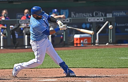 Apr 3, 2021; Kansas City, Missouri, USA; Kansas City Royals first baseman Carlos Santana (41) doubles in two runs during the sixth inning against the Texas Rangers at Kauffman Stadium. Mandatory Credit: Peter Aiken-USA TODAY Sports