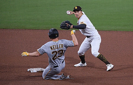 May 4, 2021; San Diego, California, USA; San Diego Padres shortstop Ha-seong Kim (R) throws to first base after forcing out Pittsburgh Pirates starting pitcher Mitch Keller (23) at second base during the fifth inning at Petco Park. Mandatory Credit: Orlando Ramirez-USA TODAY Sports