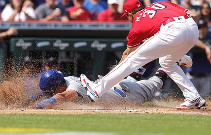 Jul 3, 2021; Cincinnati, Ohio, USA; Chicago Cubs center fielder Rafael Ortega (66) is safe at home after a wild pitch from Cincinnati Reds starting pitcher Tyler Mahle (30)  during the second inning at Great American Ball Park. Mandatory Credit: David Kohl-USA TODAY Sports