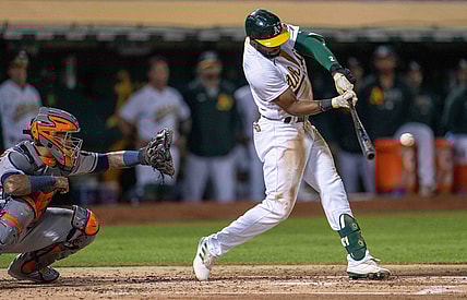 Sep 24, 2021; Oakland, California, USA;  Oakland Athletics center fielder Starling Marte (2) hits a RBI single during the third inning against the Houston Astros at RingCentral Coliseum. Mandatory Credit: Neville E. Guard-USA TODAY Sports