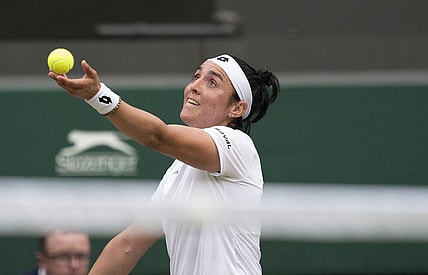 Jul 3, 2022; London, United Kingdom; Ons Jabeur (TUN) tosses the ball to serve during her match against Elise Mertens (BEL) on day seven at All England Lawn Tennis and Croquet Club. Mandatory Credit: Susan Mullane-USA TODAY Sports
