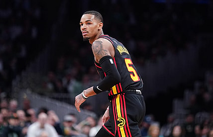 Apr 18, 2023; Boston, Massachusetts, USA; Atlanta Hawks guard Dejounte Murray (5) looks back to the Boston Celtics bench after shooting a three point basket in the third quarter during game two of the 2023 NBA playoffs at TD Garden. Mandatory Credit: David Butler II-USA TODAY Sports