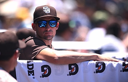 Jun 12, 2022; San Diego, California, USA; San Diego Padres acting manager Ryan Flaherty looks on from the dugout during the third inning against the Colorado Rockies at Petco Park. Mandatory Credit: Orlando Ramirez-USA TODAY Sports