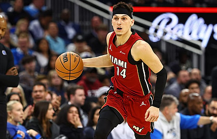 Dec 20, 2023; Orlando, Florida, USA; Miami Heat guard Tyler Herro (14) dribbles the ball against the Orlando Magic during the second quarter at KIA Center. Mandatory Credit: Kim Klement Neitzel-USA TODAY Sports