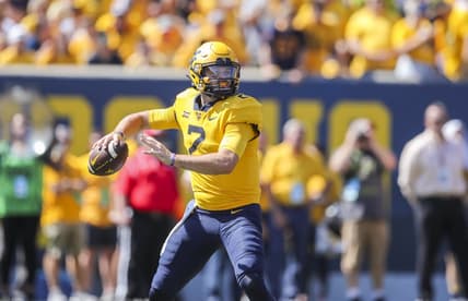 Sep 18, 2021; Morgantown, West Virginia, USA; West Virginia Mountaineers quarterback Jarret Doege (2) throws a pass during the first quarter against the Virginia Tech Hokies at Mountaineer Field at Milan Puskar Stadium. Mandatory Credit: Ben Queen-USA TODAY Sports