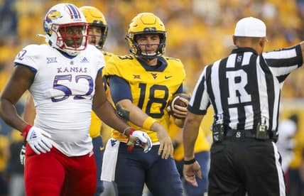 Sep 10, 2022; Morgantown, West Virginia, USA; West Virginia Mountaineers quarterback JT Daniels (18) reacts after a penalty during the second quarter against the Kansas Jayhawks at Mountaineer Field at Milan Puskar Stadium. Mandatory Credit: Ben Queen-USA TODAY Sports