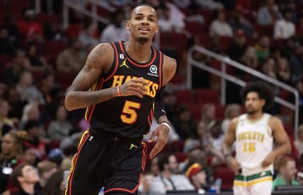 Nov 25, 2022; Houston, Texas, USA;  Atlanta Hawks guard Dejounte Murray (5) celebrates his three point basket against the Houston Rockets in the second quarter at Toyota Center. Mandatory Credit: Thomas Shea-USA TODAY Sports