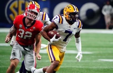 Dec 3, 2022; Atlanta, GA, USA; LSU Tigers wide receiver Kayshon Boutte (7) carries the ball for a receiving touchdown against the Georgia Bulldogs during the first quarter of the SEC Championship game at Mercedes-Benz Stadium. Mandatory Credit: John David Mercer-USA TODAY Sports
