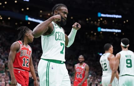Jan 9, 2023; Boston, Massachusetts, USA; Boston Celtics guard Jaylen Brown (7) reacts after a basket by forward Grant Williams (12) against the Chicago Bulls in the second half at TD Garden. Mandatory Credit: David Butler II-USA TODAY Sports