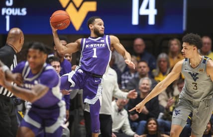 Mar 4, 2023; Morgantown, West Virginia, USA; Kansas State Wildcats guard Markquis Nowell (1) saves the ball from going out of bounds during the first half against the West Virginia Mountaineers at WVU Coliseum. Mandatory Credit: Ben Queen-USA TODAY Sports