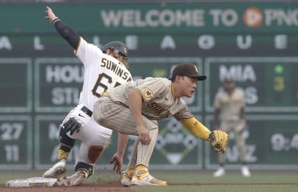 Jun 28, 2023; Pittsburgh, Pennsylvania, USA;  Pittsburgh Pirates center fielder Jack Suwinski (65) steals second base as San Diego Padres second baseman Ha-Seong Kim (7) takes a late throw during the second inning at PNC Park. Mandatory Credit: Charles LeClaire-USA TODAY Sports