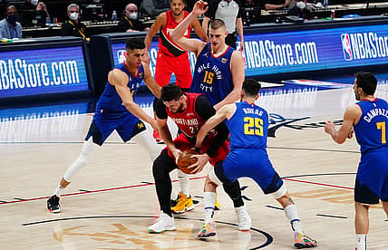 May 22, 2021; Denver, Colorado, USA; Portland Trail Blazers center Jusuf Nurkic (27) is surrounded by Denver Nuggets forward Michael Porter Jr. (1) and center Nikola Jokic (15) and guard Austin Rivers (25) in the fourth quarter during game one in the first round of the 2021 NBA Playoffs at Ball Arena. Mandatory Credit: Ron Chenoy-USA TODAY Sports