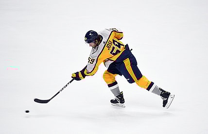 Mar 23, 2021; Nashville, Tennessee, USA; Nashville Predators defenseman Roman Josi (59) shoots the puck during warmups before the game against the Detroit Red Wings at Bridgestone Arena. Mandatory Credit: Christopher Hanewinckel-USA TODAY Sports