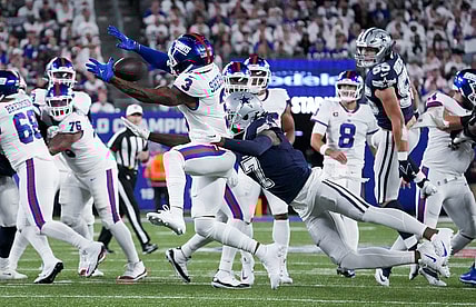 Sep 26, 2022; East Rutherford, NJ, USA;  Dallas Cowboys cornerback Trevon Diggs (7) defends the pass intended for New York Giants wide receiver Sterling Shepard (3) during the first quarter at MetLife Stadium. Mandatory Credit: Robert Deutsch-USA TODAY Sports