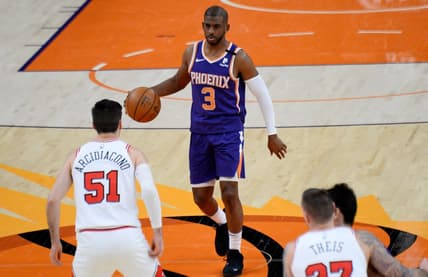 Mar 31, 2021; Phoenix, Arizona, USA; Phoenix Suns guard Chris Paul (3) dribbles the ball against the Chicago Bulls during the first half at Phoenix Suns Arena. Mandatory Credit: Joe Camporeale-USA TODAY Sports