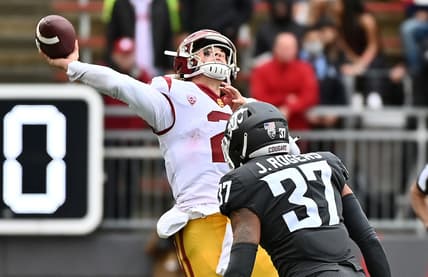 Sep 18, 2021; Pullman, Washington, USA; USC Trojans quarterback Jaxson Dart (2) throws the ball up before Washington State Cougars linebacker Justus Rogers (37) can get to him in the second half at Gesa Field at Martin Stadium. The Trojans won 45-14. Mandatory Credit: James Snook-USA TODAY Sports
