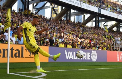 Jun 19, 2022; Nashville, Tennessee, USA; Nashville SC midfielder Hany Mukhtar (10) attempts a corner kick during the first half against Sporting Kansas City at Geodis Park. Mandatory Credit: Christopher Hanewinckel-USA TODAY Sports
