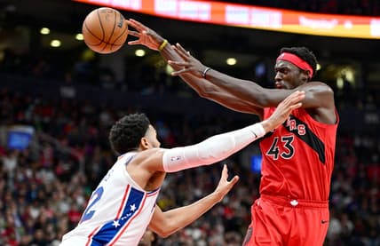 Oct 26, 2022; Toronto, Ontario, CAN; Toronto Raptors forward Pascal Siakam (3) passes the ball over Philadelphia 76ers forward Tobias Harris in the second half at Scotiabank Arena. Mandatory Credit: Dan Hamilton-USA TODAY Sports