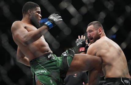 Mar 5, 2022; Las Vegas, Nevada, UNITED STATES; Nicolae Negumereanu (red gloves) fights Kennedy Nzechukwu (blue gloves) during UFC 272 at T-Mobile Arena. Mandatory Credit: Stephen R. Sylvanie-USA TODAY Sports