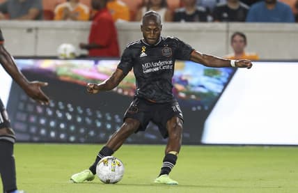 Sep 13, 2022; Houston, Texas, USA; Houston Dynamo FC midfielder Fafa Picault (10) kicks the ball during the second half against the New England Revolution at PNC Stadium. Mandatory Credit: Troy Taormina-USA TODAY Sports
