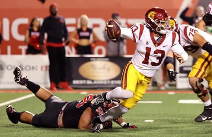 Oct 15, 2022; Salt Lake City, Utah, USA; USC Trojans quarterback Caleb Williams (13) breaks a tackle by Utah Utes defensive tackle Junior Tafuna (58) in the second quarter at Rice-Eccles Stadium. Mandatory Credit: Rob Gray-USA TODAY Sports