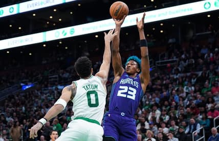 Nov 28, 2022; Boston, Massachusetts, USA; Charlotte Hornets forward Kai Jones (23) shoots against Boston Celtics forward Jayson Tatum (0) in the second quarter at TD Garden. Mandatory Credit: David Butler II-USA TODAY Sports