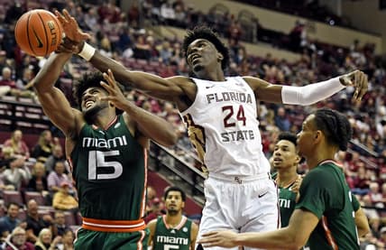 Jan 24, 2023; Tallahassee, Florida, USA; Miami Hurricanes forward Norchad Omier (15) fights for a rebound against Florida State Seminoles center Naheem McLeod (24) during the second half at Donald L. Tucker Center. Mandatory Credit: Melina Myers-USA TODAY Sports