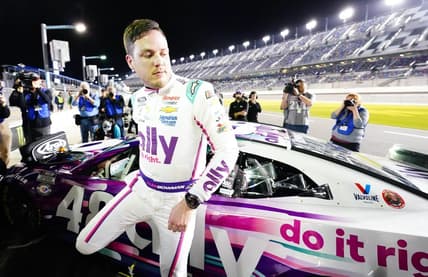 Feb 15, 2023; Daytona Beach, Florida, USA; NASCAR Cup Series driver Alex Bowman (48) exits his car as he celebrates winning the pole during qualifying at Daytona International Speedway. Mandatory Credit: John David Mercer-USA TODAY Sports