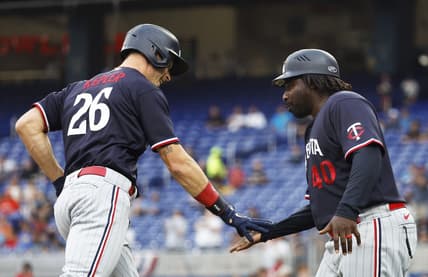Apr 3, 2023; Miami, Florida, USA;  Minnesota Twins right fielder Max Kepler (26) is congratulated by third base coach coach Tommy Watkins (40) after his home run against the Miami Marlins during the first inning at loanDepot Park. Mandatory Credit: Rhona Wise-USA TODAY Sports