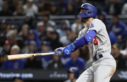 Apr 25, 2023; Pittsburgh, Pennsylvania, USA;  Los Angeles Dodgers third baseman Chris Taylor (3) hits a there run home run against the Pittsburgh Pirates during the eighth inning at PNC Park. Mandatory Credit: Charles LeClaire-USA TODAY Sports