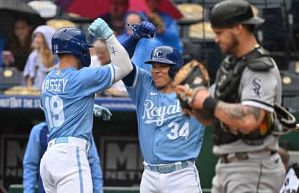 May 11, 2023; Kansas City, Missouri, USA;  Kansas City Royals second baseman Michael Massey (19) celebrates with catcher Freddy Fermin (34) after hitting a solo home run during the second inning against the Chicago White Sox at Kauffman Stadium. Mandatory Credit: Peter Aiken-USA TODAY Sports