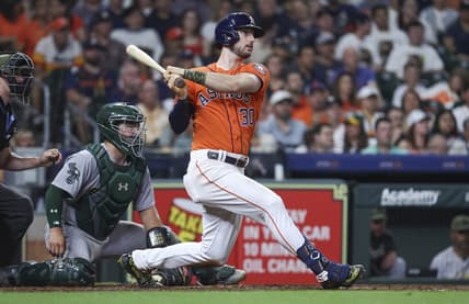 May 19, 2023; Houston, Texas, USA; Houston Astros right fielder Kyle Tucker (30) hits an RBI double during the fourth inning against the Oakland Athletics at Minute Maid Park. Mandatory Credit: Troy Taormina-USA TODAY Sports