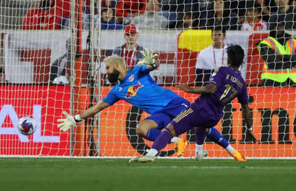 Jun 3, 2023; Harrison, New Jersey, USA;  Orlando City forward Facundo Torres (17) scores a goal past New York Red Bulls goalkeeper Carlos Miguel Coronel (1) in the second half at Red Bull Arena. Mandatory Credit: Vincent Carchietta-USA TODAY Sports